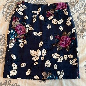 Ann Taylor navy pencil skirt with floral pattern.